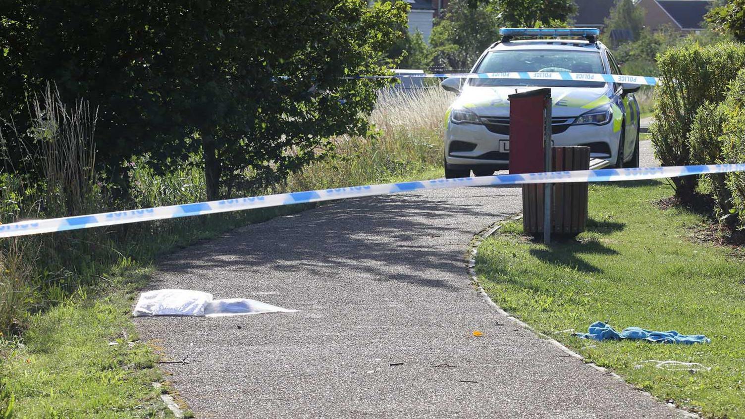 Police at a scene of a stabbing in Wootton, Bedfordshire