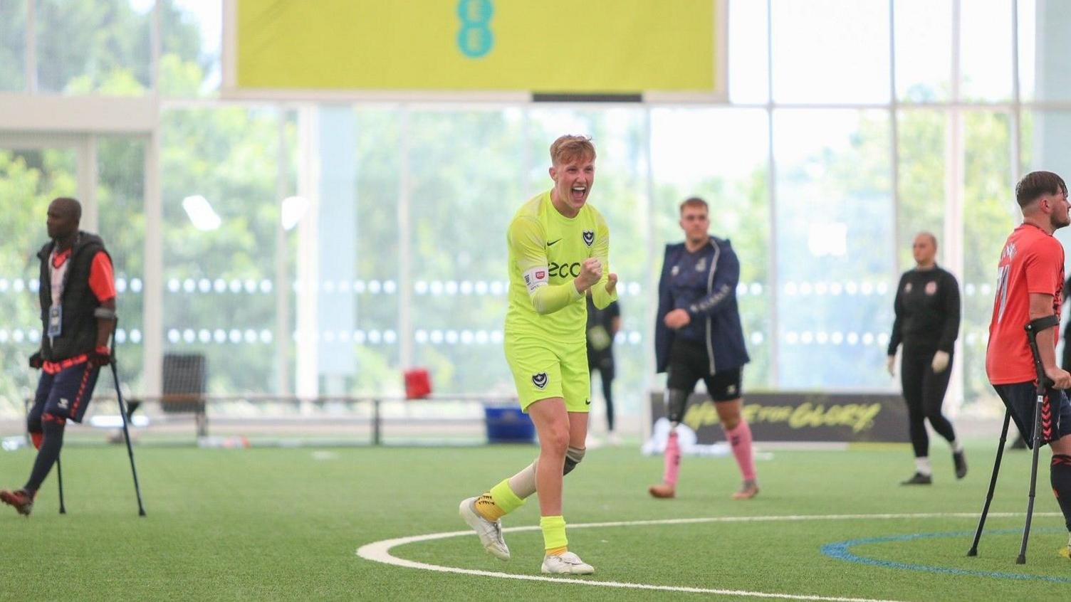 Thomas Atkinson on the pitch with other players