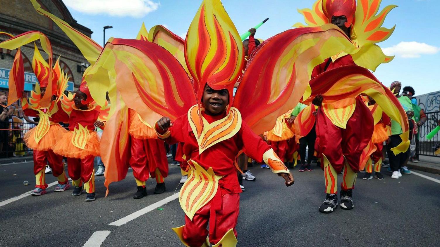 Children wearing colourful costumes.