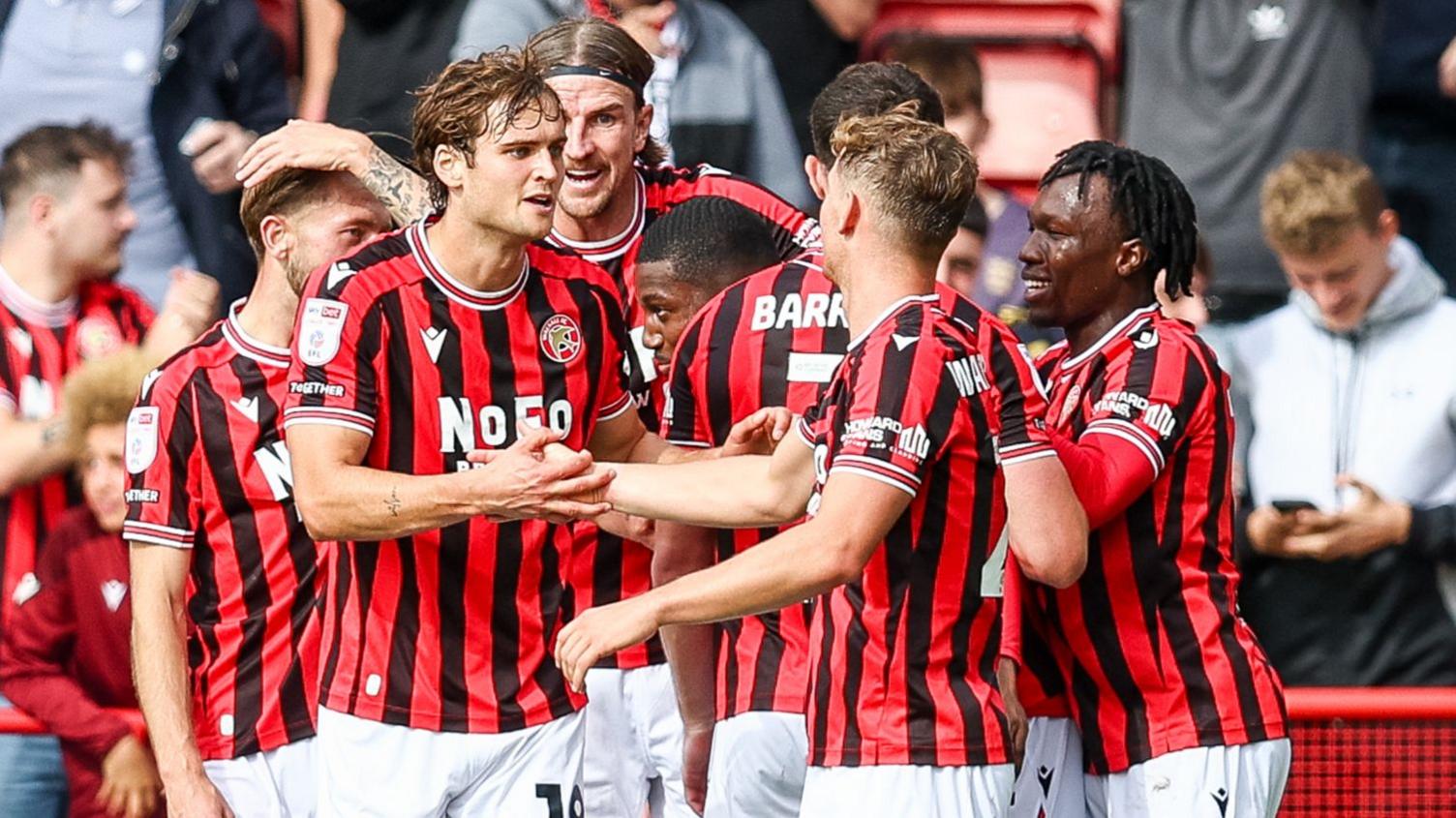 Walsall players celebrates Daniel Kanu's goal