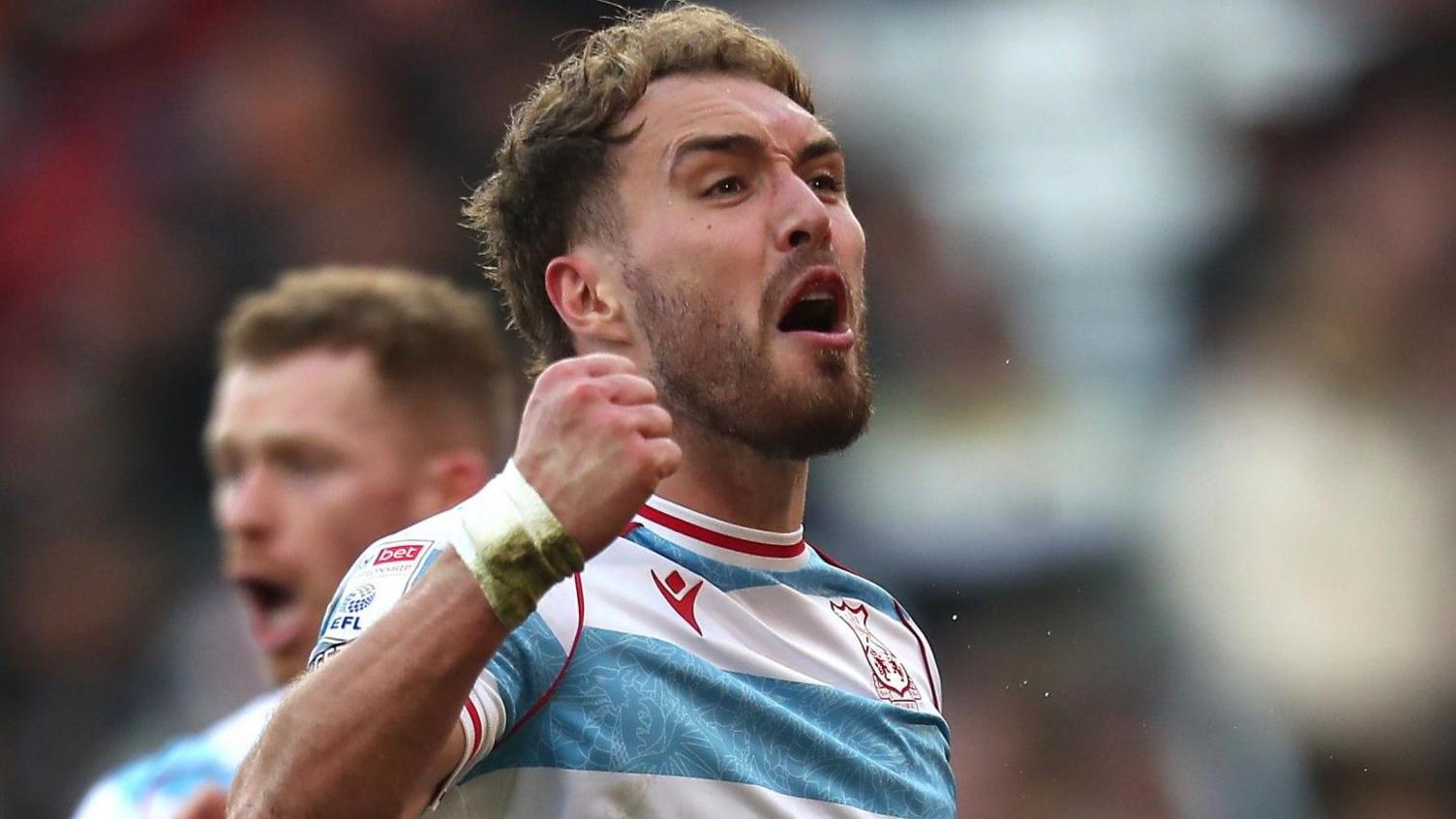 Wrexham striker Sam Smith celebrates