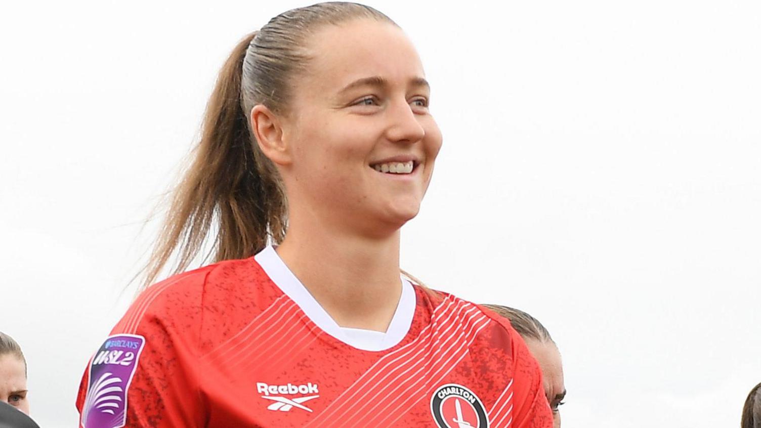 Mia Ross walks on to the pitch with Charlton Athletic