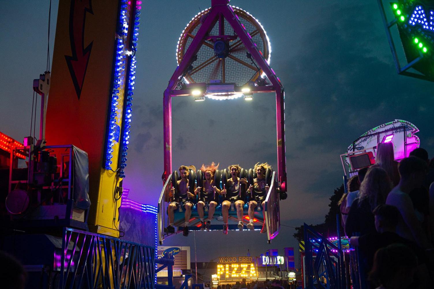 People on a fairground ride at the Isle of Wight Festival