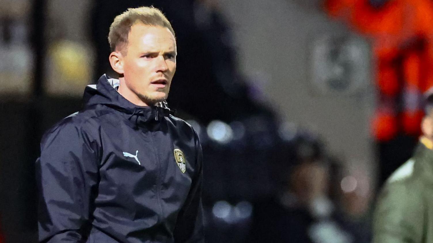 Notts County assistant head coach Matt Saunders on the side of the pitch