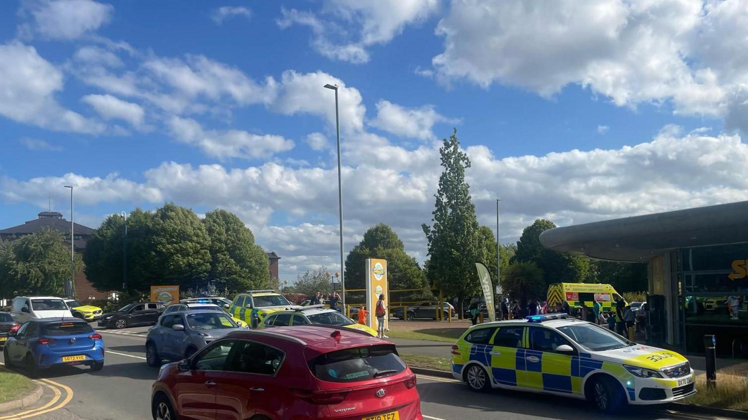 Police cars and normal cars outside waterworld