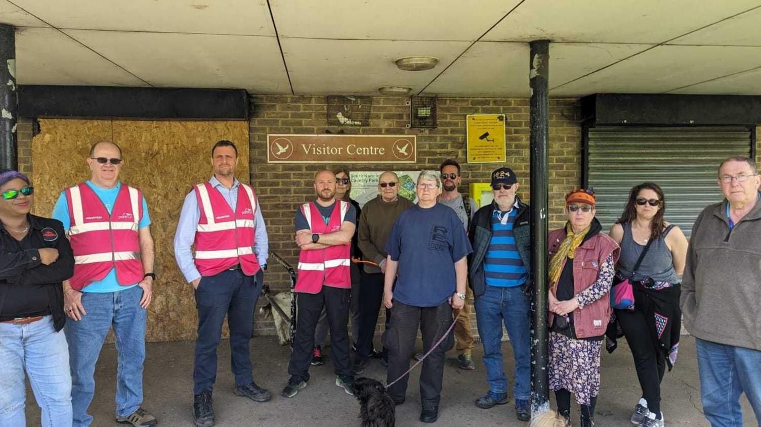 Volunteers in front of visitor centre