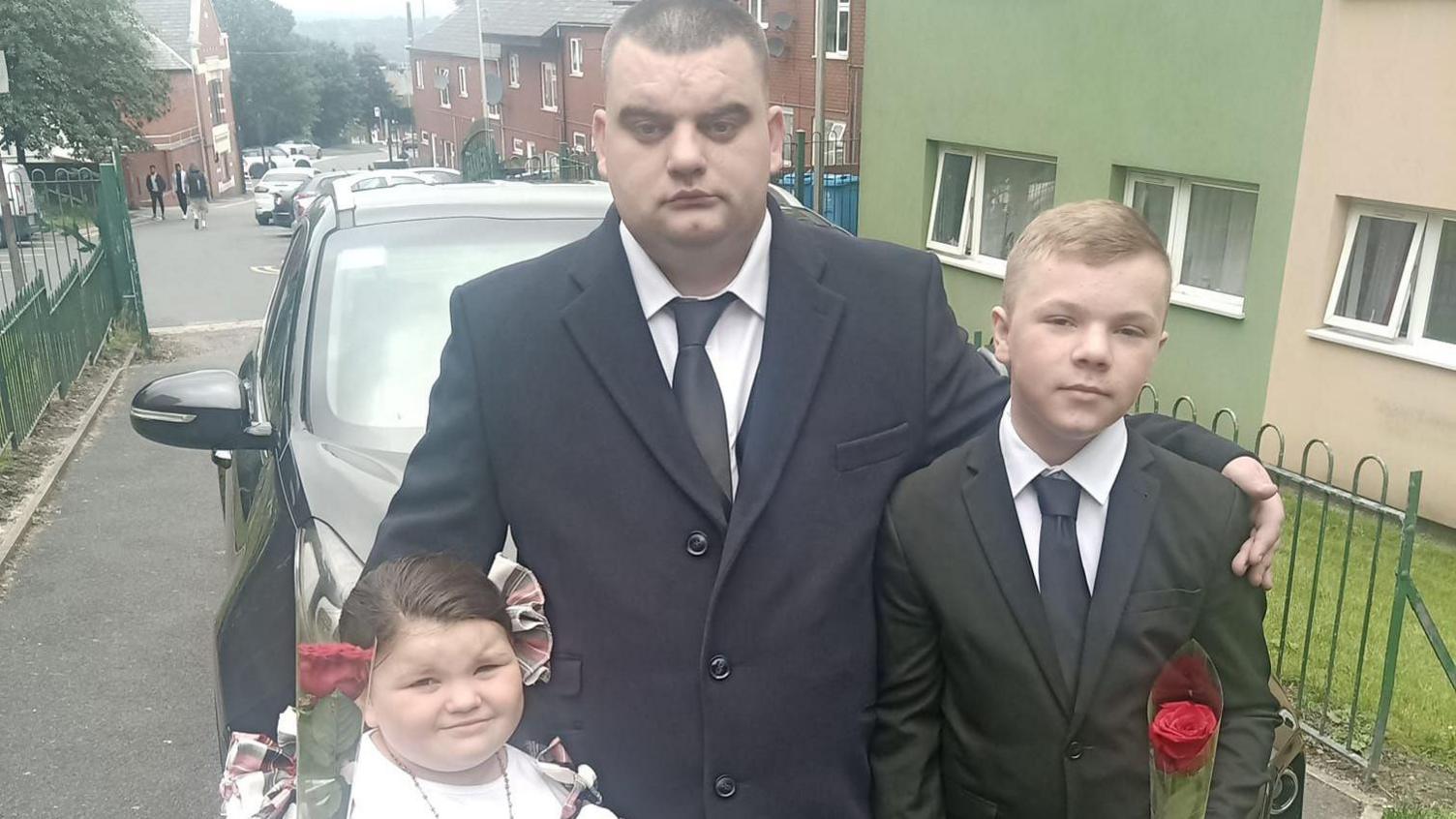 Michael Davies from Oldham with his two children