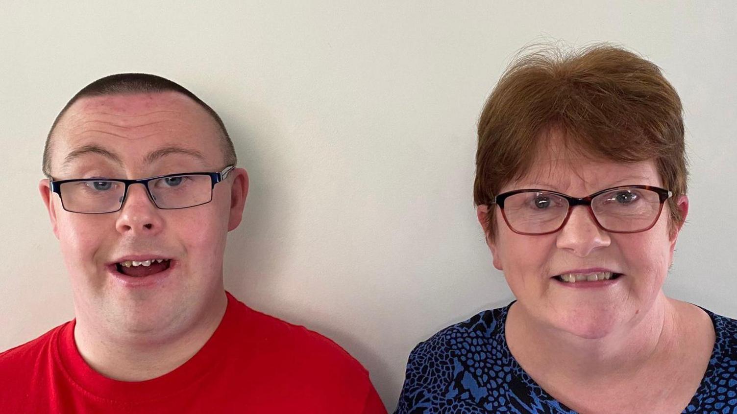 Daniel and his mother Gabrielle O'Reilly both are wearing glasses