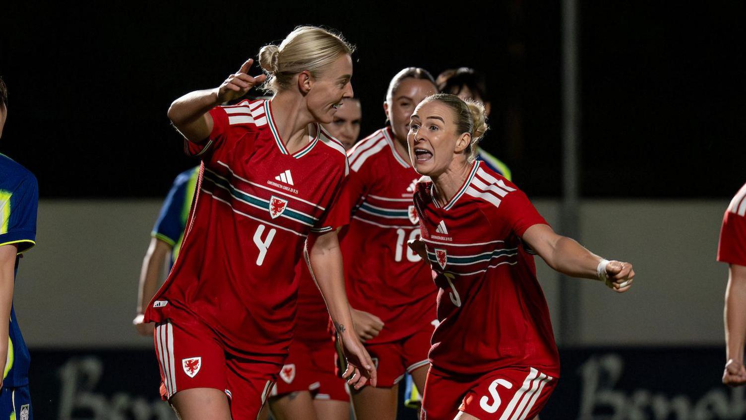 Sophie Ingle celebrates with Rhiannon Roberts 