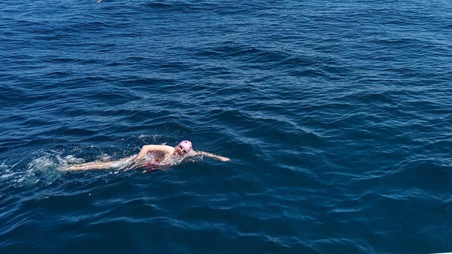 Hannah Litchfield swimming in pink in the English Channel.