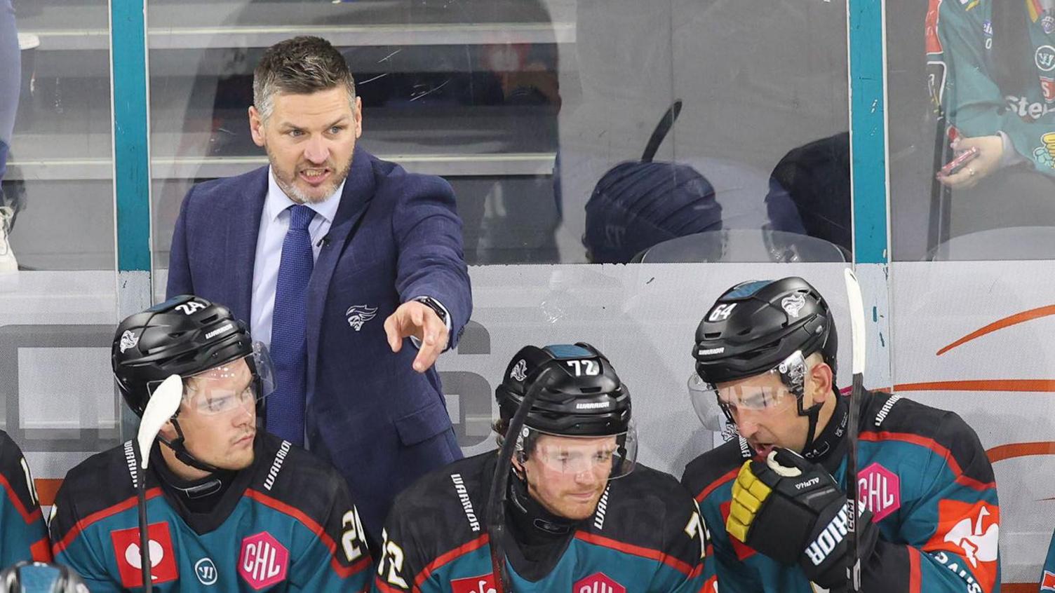 Adam Keefe shouting instructions on the Giants bench