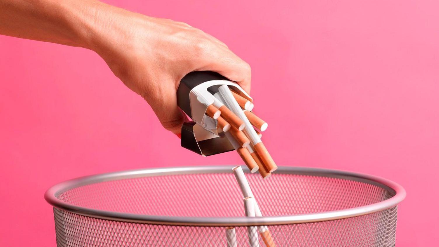 cigarettes being poured into bin. 