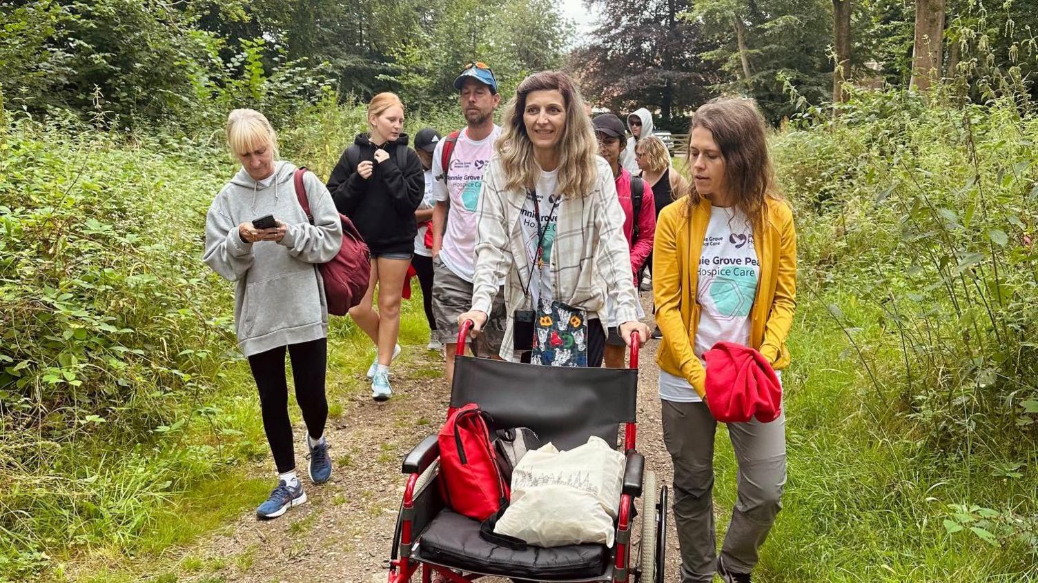 Liene uses a wheelchair to join the charity walk she organised