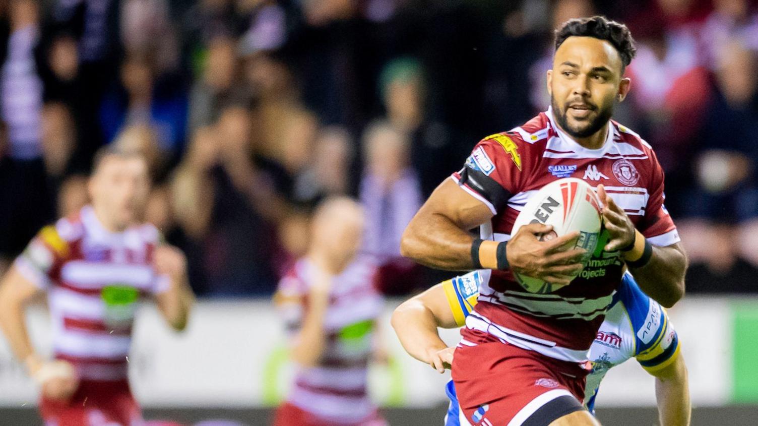 Wigan Warriors' Bevan French runs through for a try