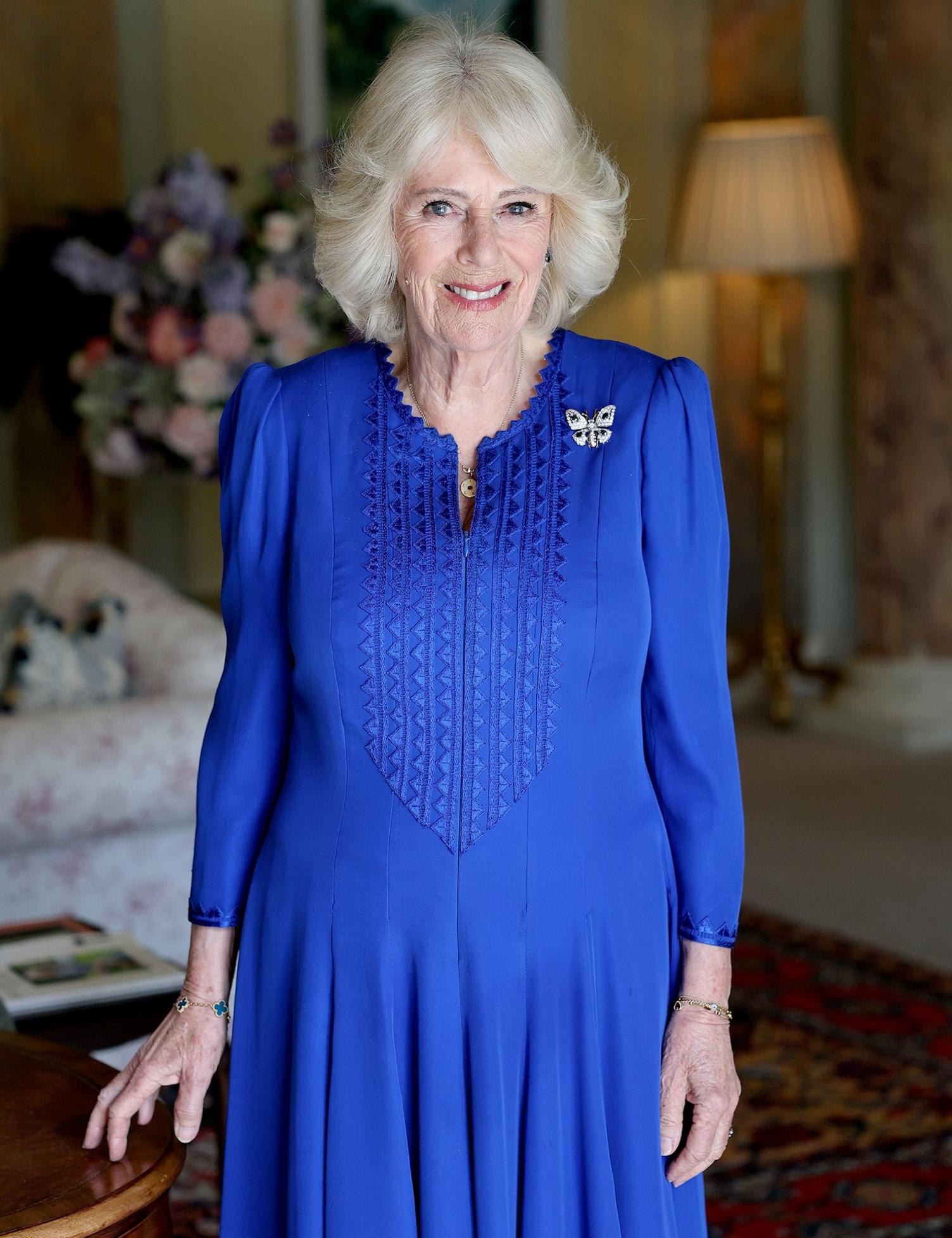 A picture of Queen Camilla in a blue dress