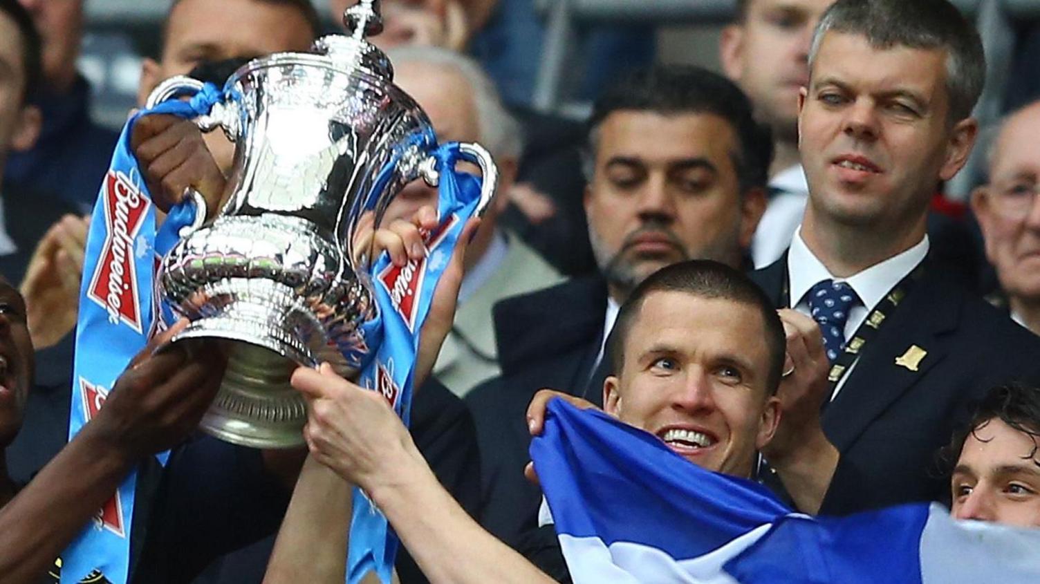 Gary Caldwell lifts the FA Cup