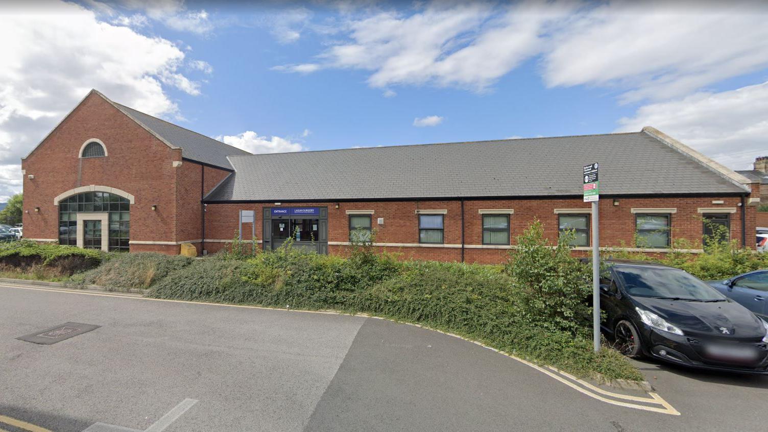 The Lagan Surgery. It is a red-brick building with a grey roof.