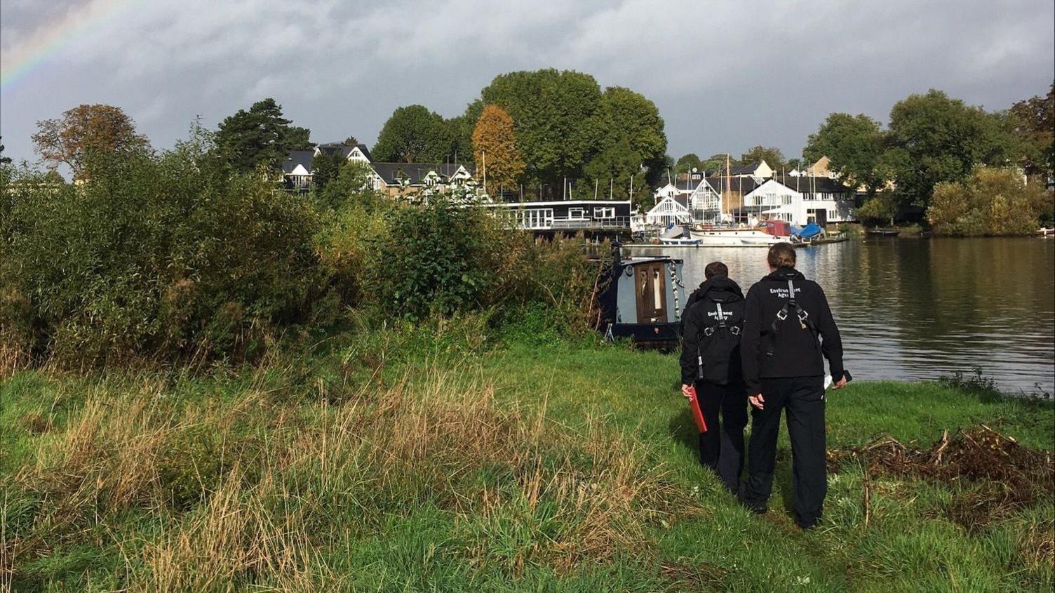 officers approaching the scene on the banks of the River Thames