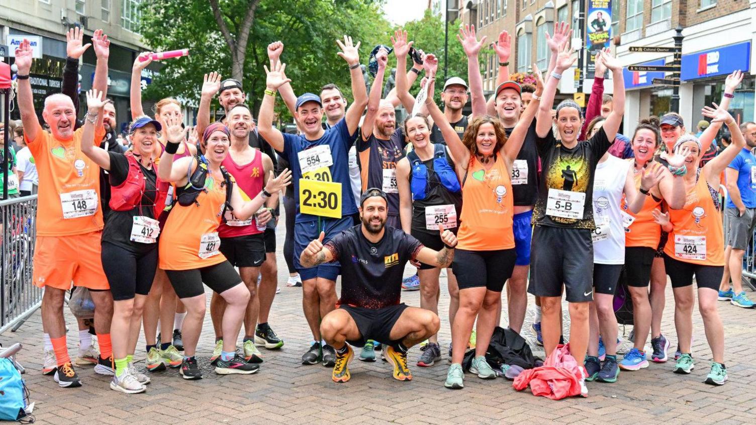 Runners pose at the 2023 Northampton half marathon