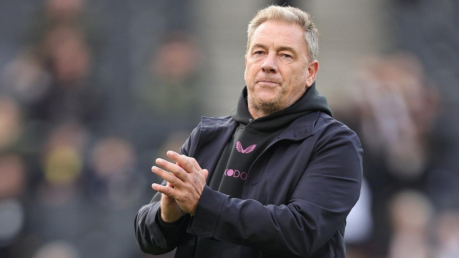 MK Dons boss Scott Lindsey leaves the pitch following their game against Port Vale in October