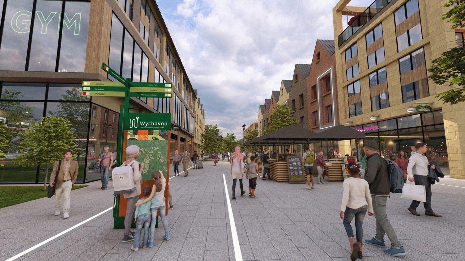 The image shows a modern, pedestrian-only town centre with wide grey pavements and new buildings on both sides. People walk, shop and browse small market stalls under umbrellas.