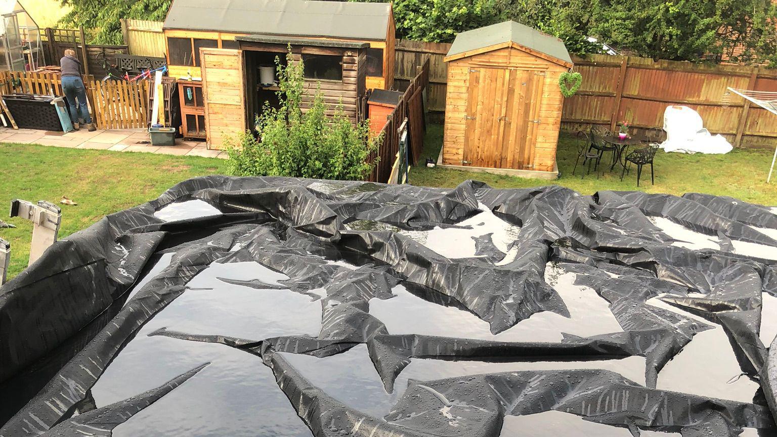 Puddled water left on a roof on the top of the roof at Annette Wilkinson's house.