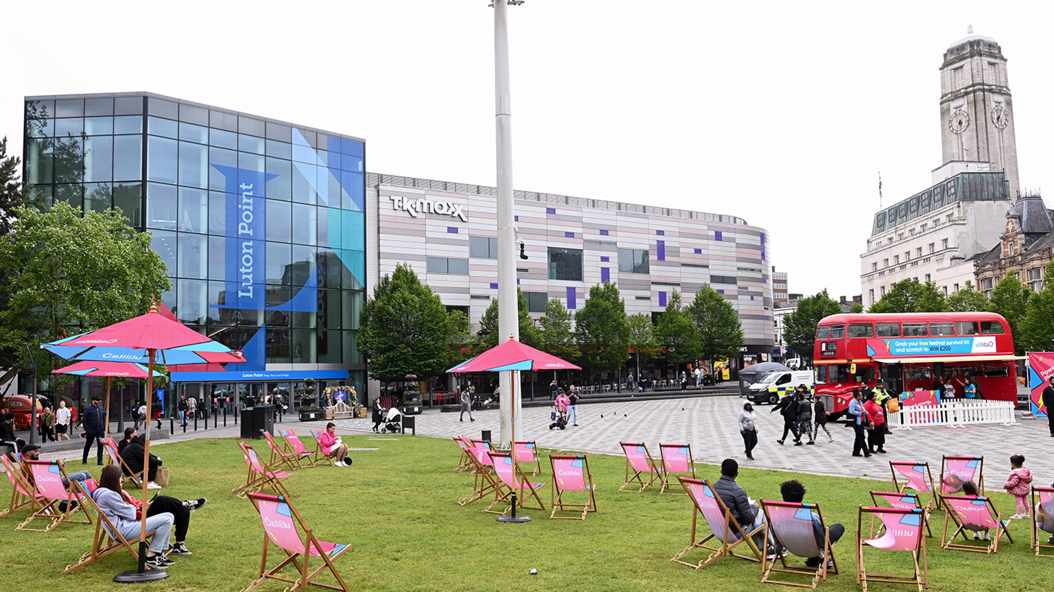 The centre of Luton, with people sitting in deckchairs, by Luton Point