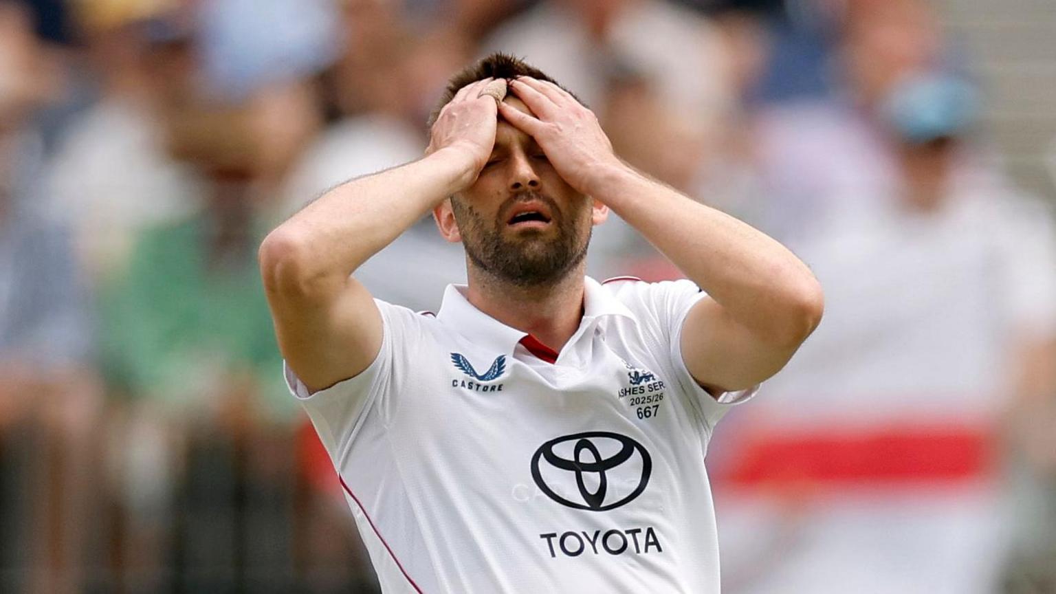 England fast bowler Mark Wood puts his hands on his head