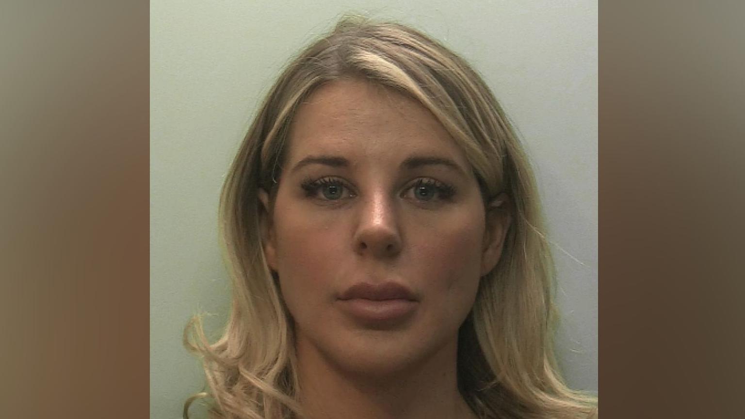 Police mugshot of Paris Wilson, who has shoulder length blonde hair.