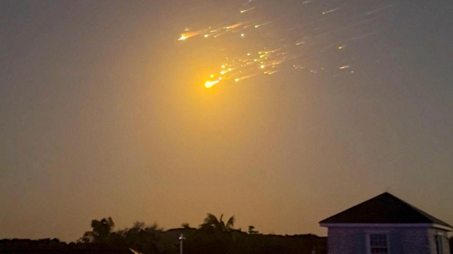 Debris is seen falling from the sky in The Bahamas