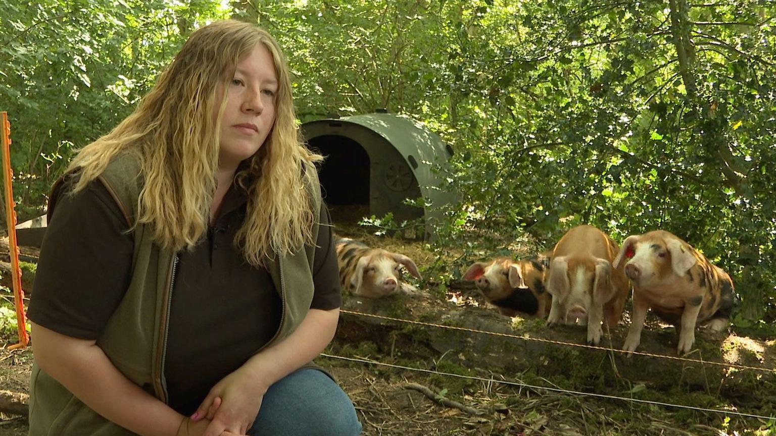 Jasmine Pattison and her Oxford Sandy and Black piglets