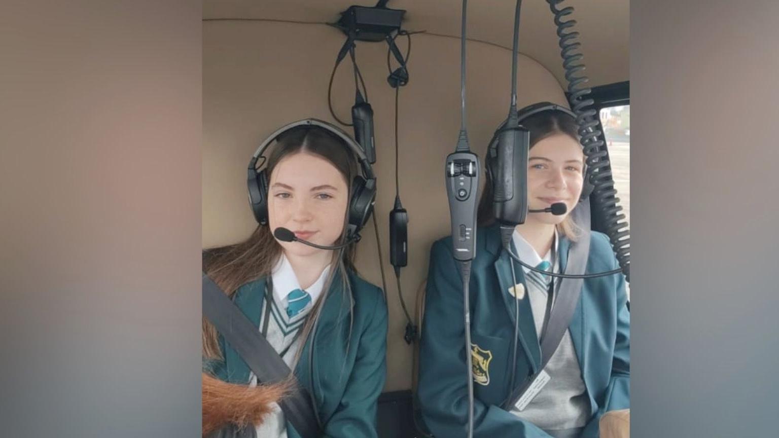 Two of the girls in the helicopter. 