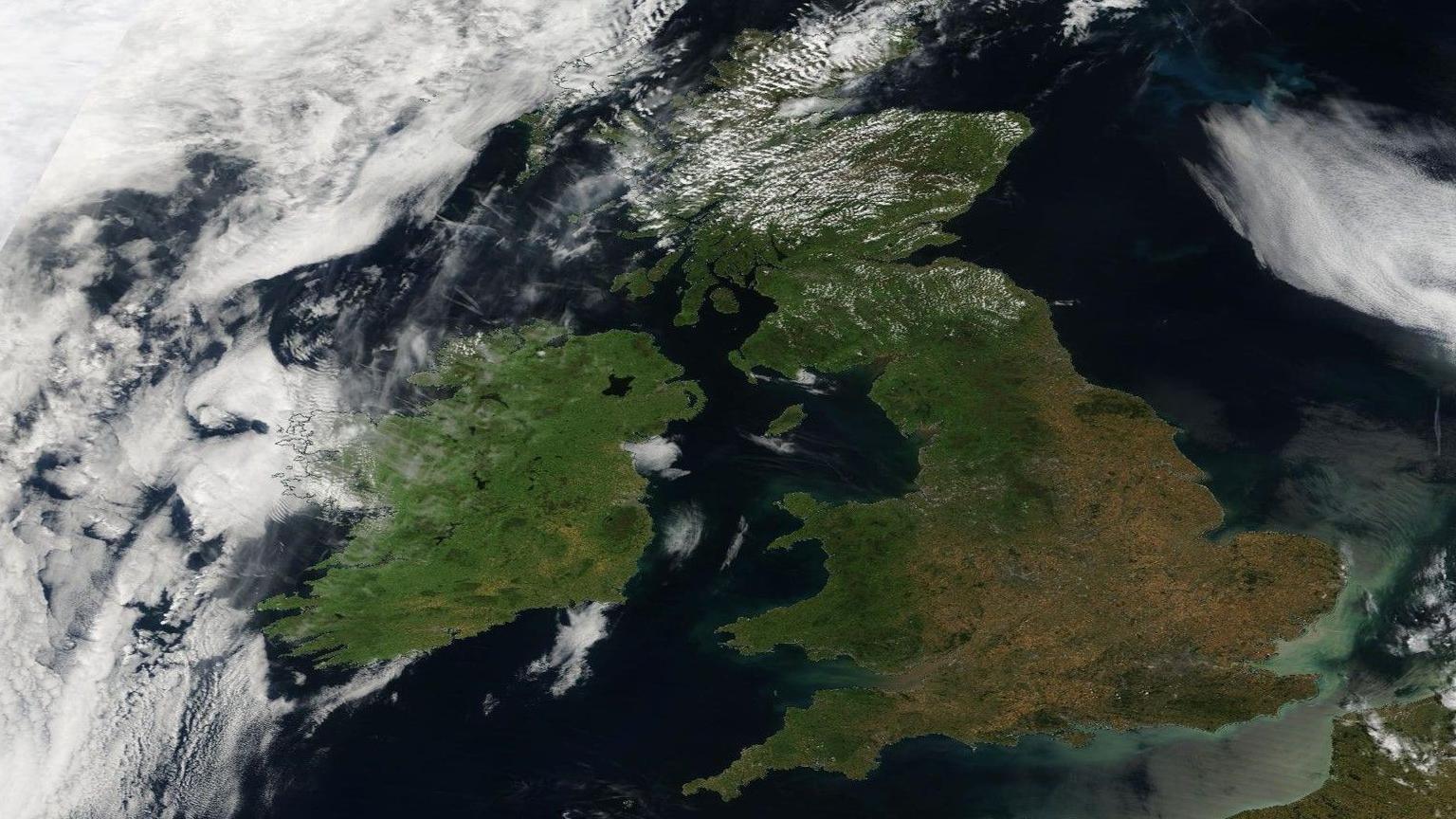 A satellite image of the UK, with much of southern England and the Midlands looking brown and parched.