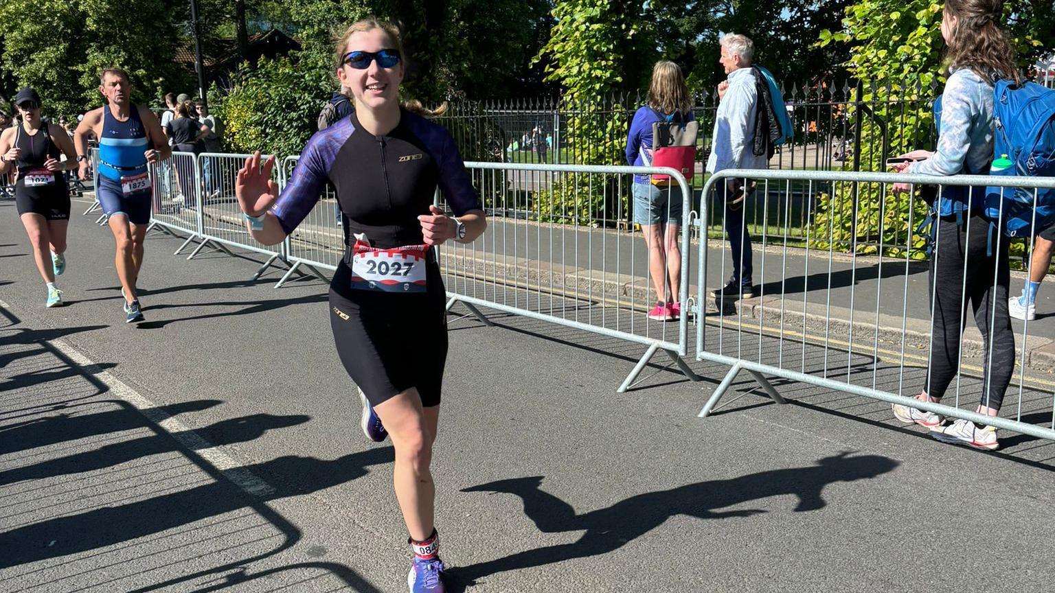 Rebecca Norman, running in the triathlon