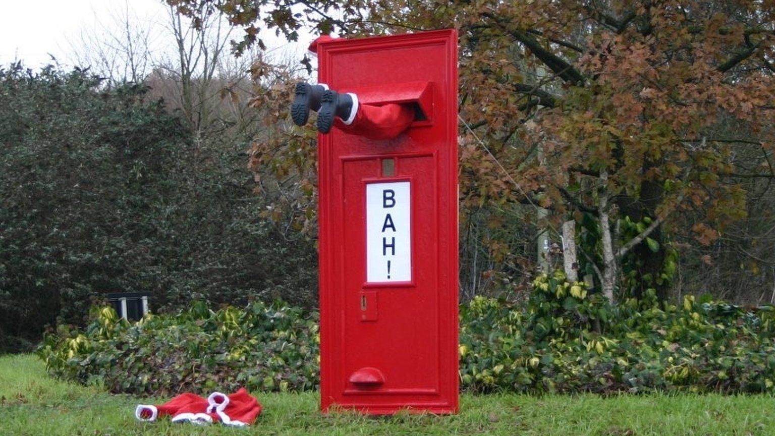 Father Christmas stuck in postbox