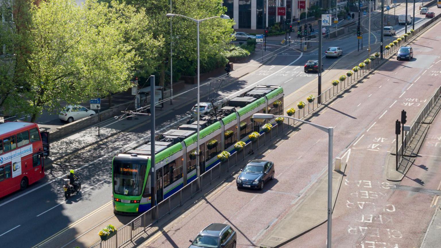 Aerial view showing London Tram service amid street traffic