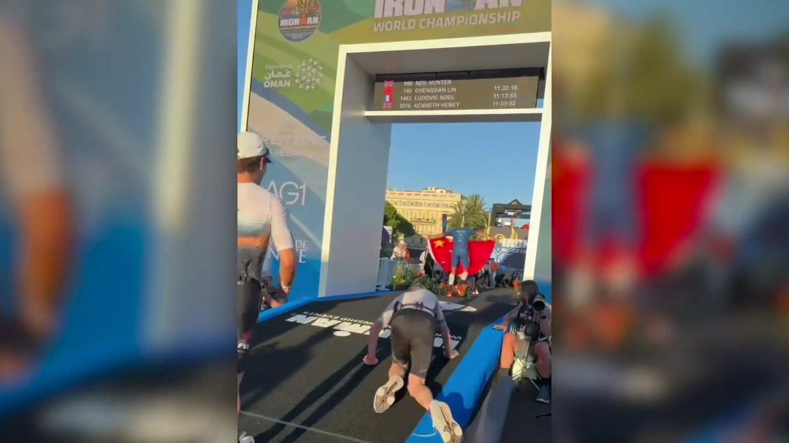 Neil Hunter crawls to the finish line in Nice