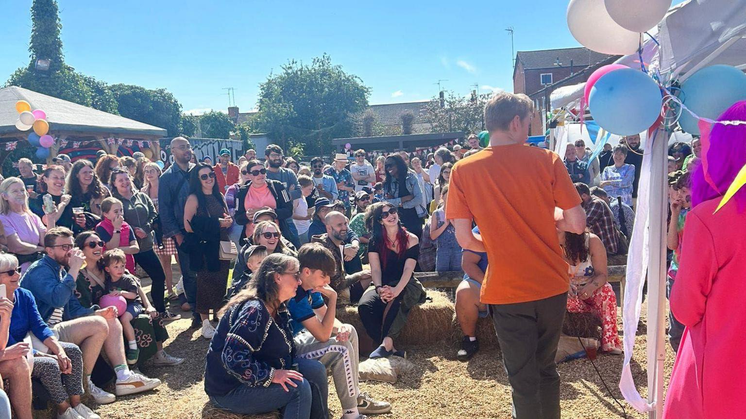 James Acaster and a crowd at the summer fete