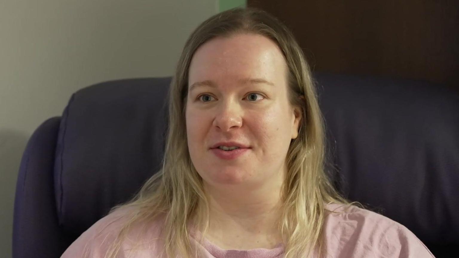 Georgie Peterson: a woman with long, blonde hair wearing a pink top