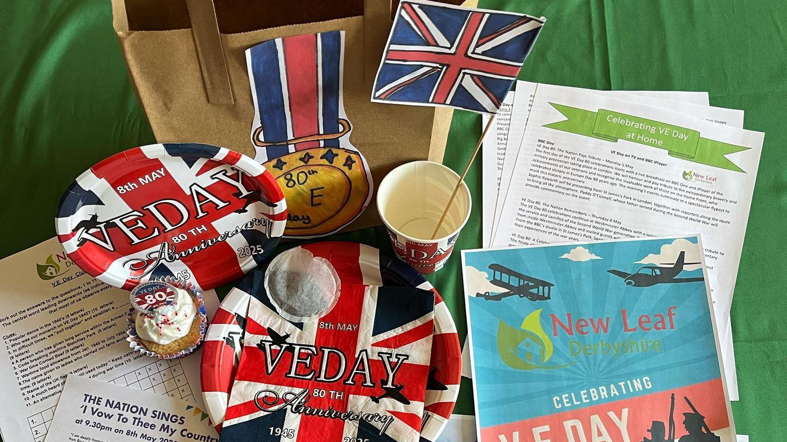 The items in a pack laid out on a green tablecloth