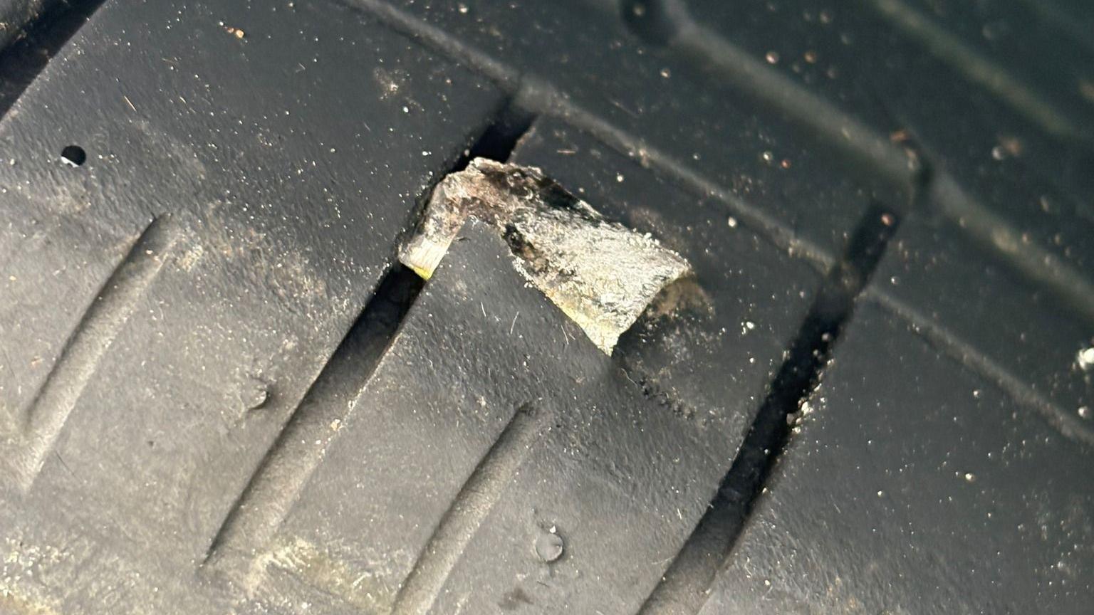 One of the metal shards is shown lodged into a tyre.