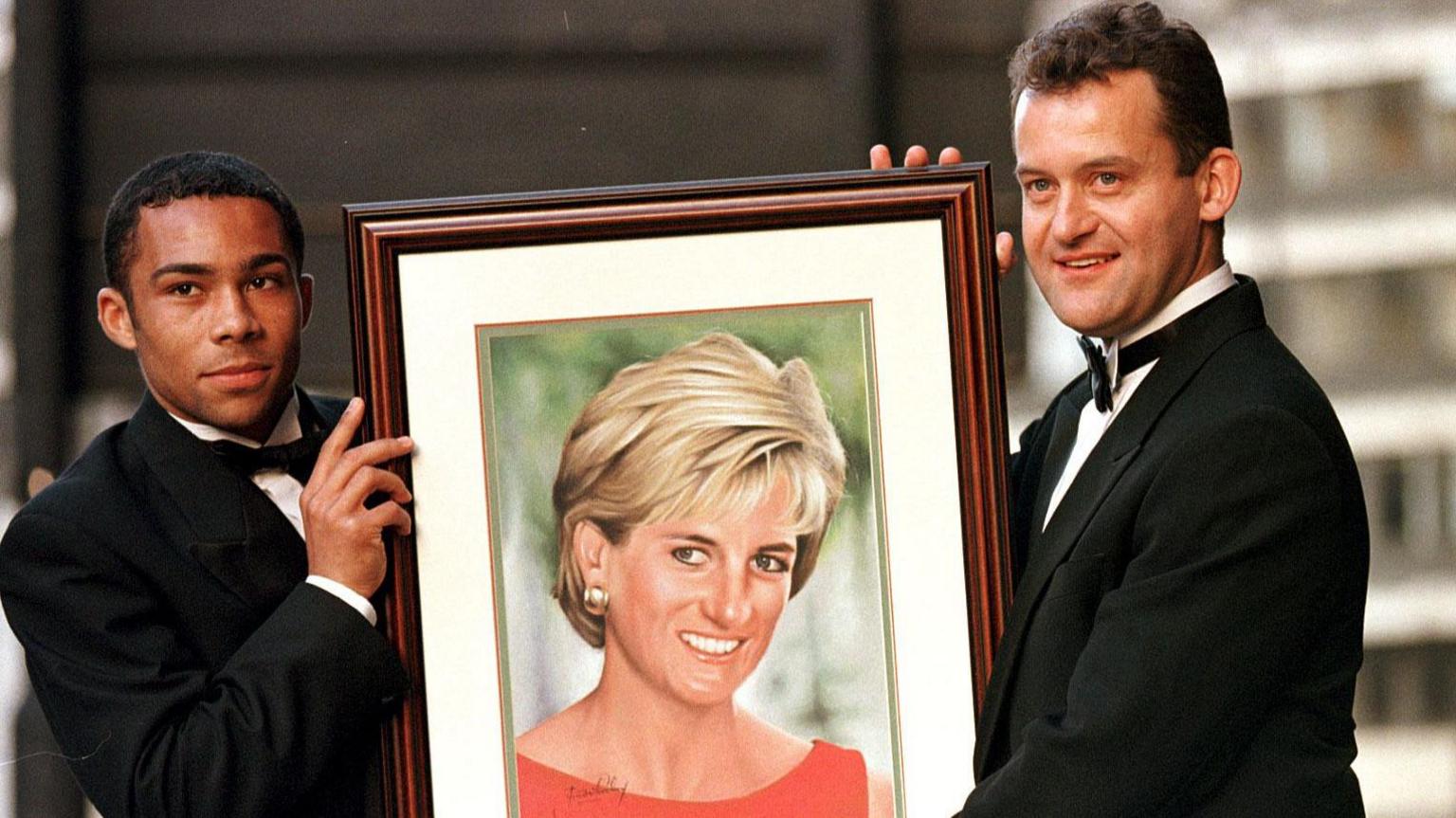 Jim Whitley and Paul Burrell with portrait of Princess Diana