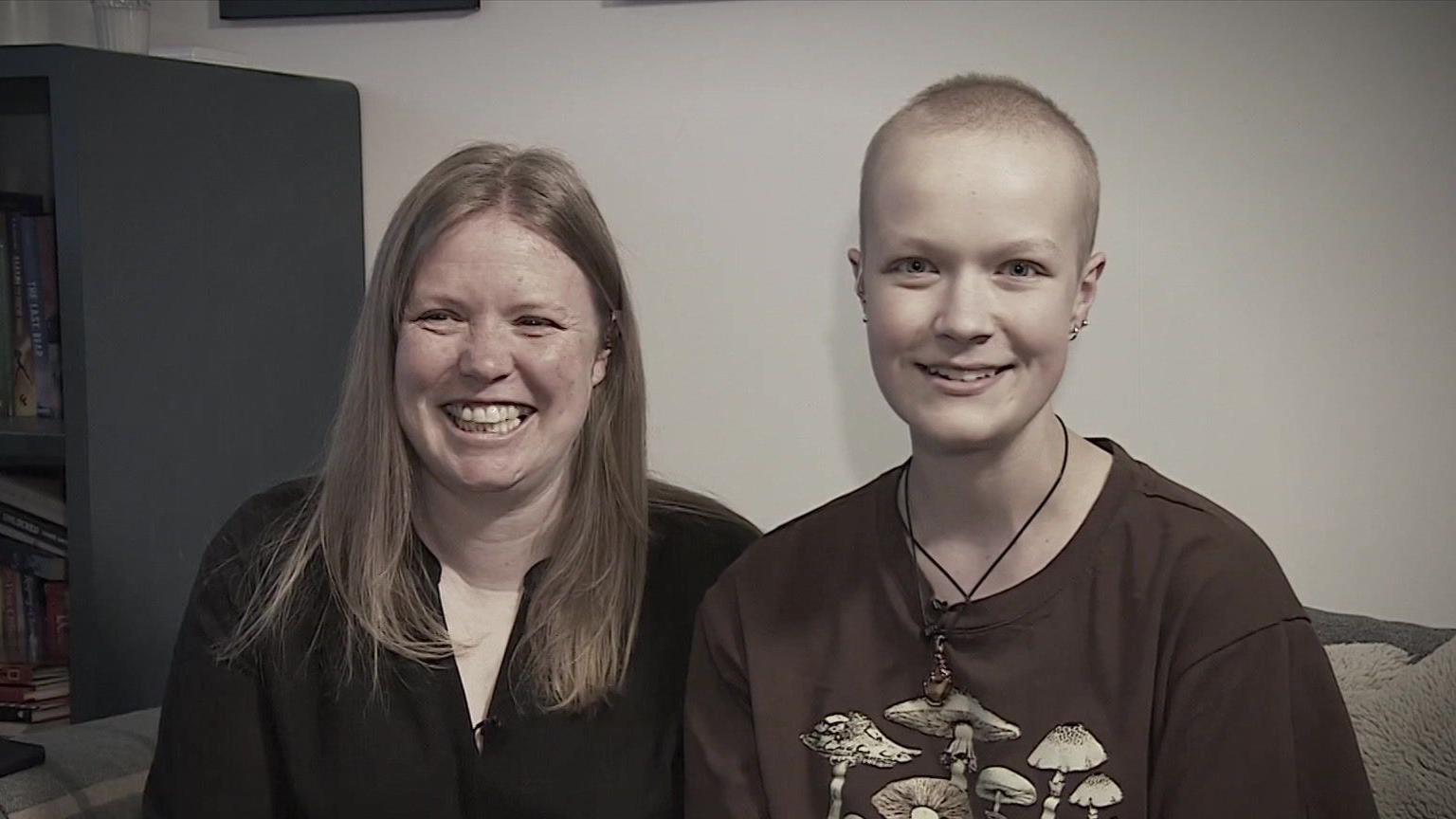 Vicky Robayna, a woman with long blonde hair wearing a black shirt and Liz Hatton, a teenage girl with short hair wearing a brown T shirt with mushrooms on it.