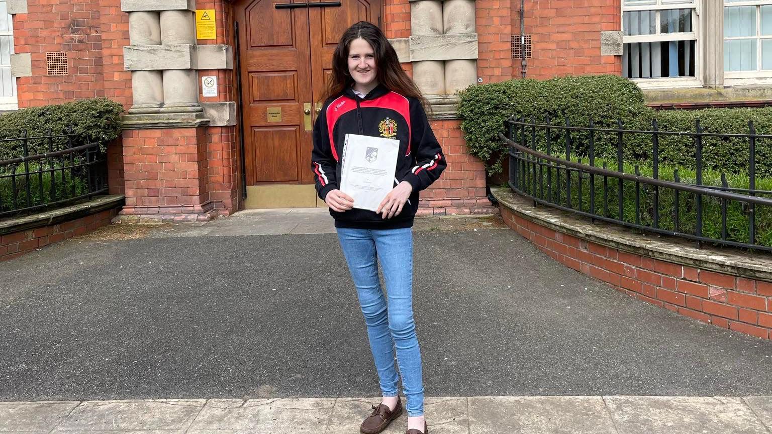 Luned Davies pictured with her dissertation in Agriculture and Business from Harper Adams University