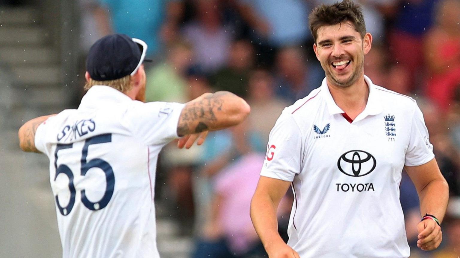 Ben Stokes, left, gestures to a smiling Josh Tongue after the England bowler dismantled India's tail