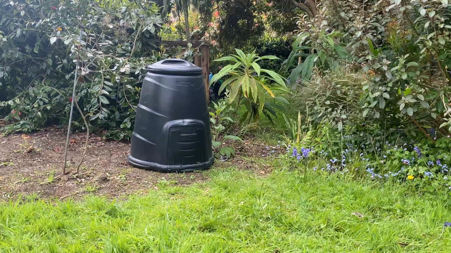 Composting bin in garden