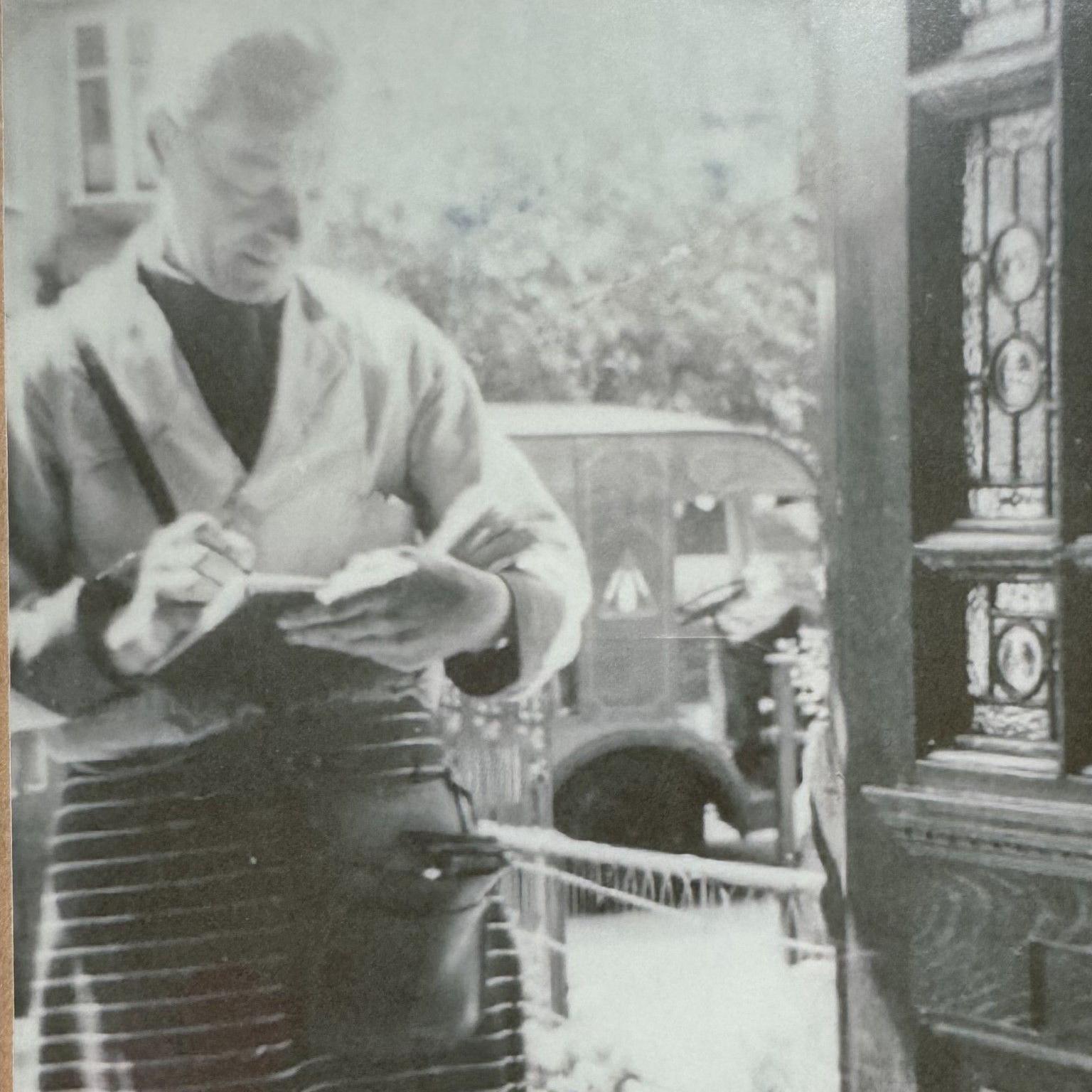 Stanley Hann is pictured in his milkman uniform while on his rounds in North London