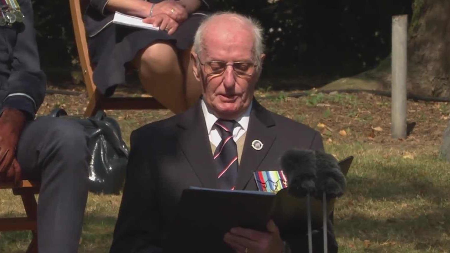 Mr Bartlett in a suit with all his medals on his jacket pocket