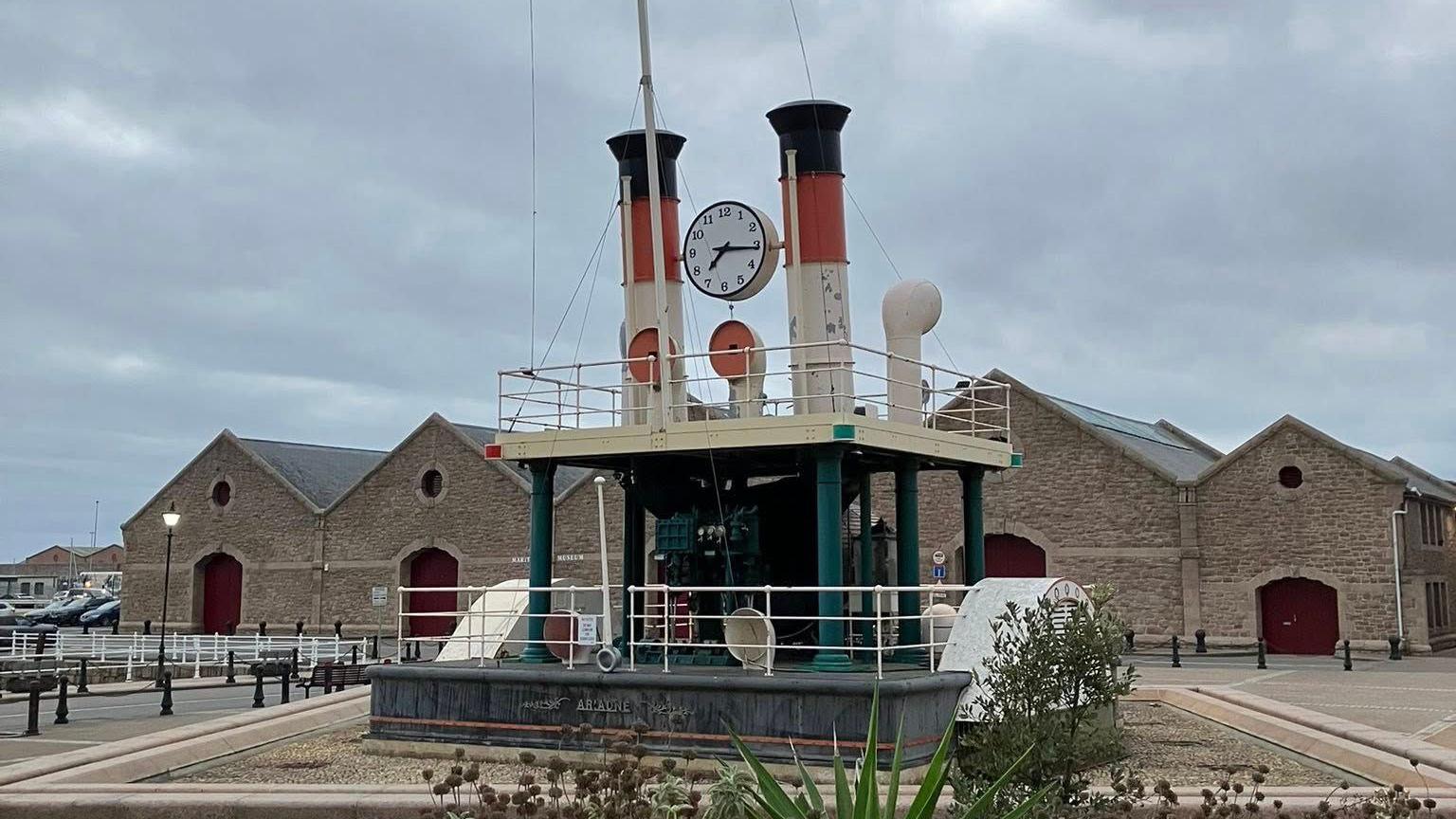 The Steam Clock in St Helier, Jersey. It is placed in front of the Maritime Museum. The clock is designed to look like two steam funnels from a paddle steamer with a large analogue clock.