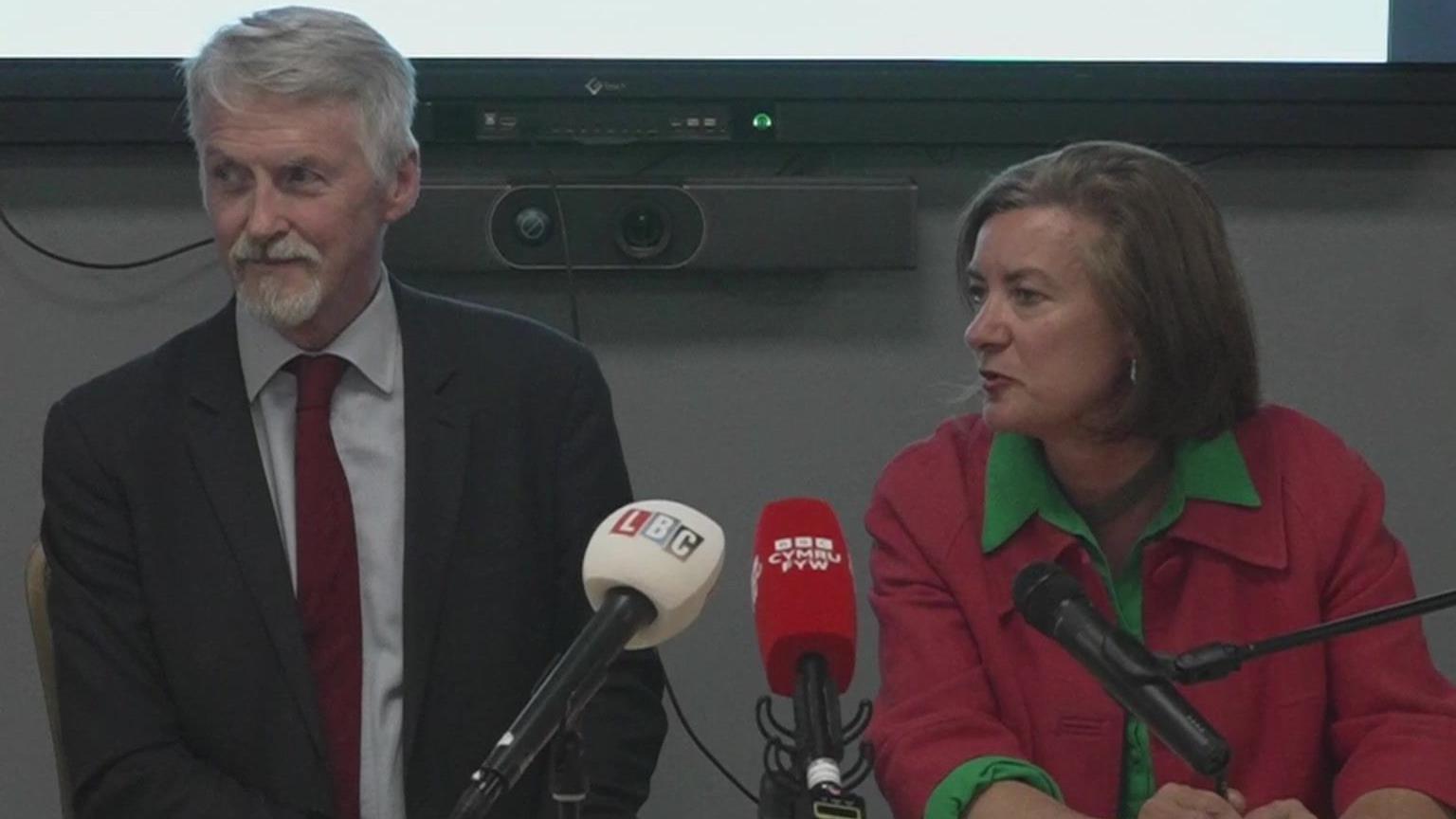 Huw Irranca-Davies and Eluned Morgan sat at a press conference on Monday